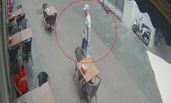 Kahvaltıda uyuyan müşterinin telefonunu alan hırsız kamerada