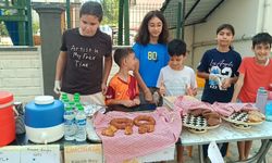 Kozan’da çocuklar yangınzedeler için topladıkları parayı teslim etti